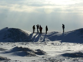 Bystanders look at a frozen Lake Erie. (Free Press file photo)