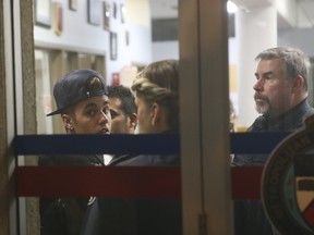 Justin Bieber arrives at Toronto Police's 52 Division Wednesday, Jan. 29, 2014, in relation to the alleged assault in December 2013 on a limo driver. (JACK BOLAND/Toronto Sun)
