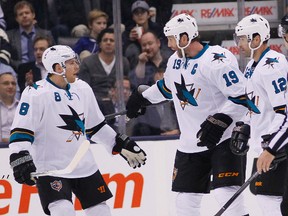 Joe Thornton, No. 15, and Patrick Marleau, shown here celebrating  goal with Joe Pavelski, No. 8, are veteran members of the Sharks who recently inked three-year extensions with the team. (USA TODAY)