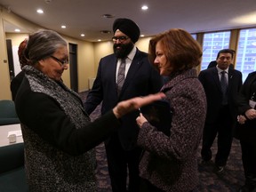 Dr. Eva Cardinal (l), Saddle Lake First Nation & Elder on Quality Council;  Premier Alison Redford (r) and Human Services Minister Manmeet Bhullar attend the second day of the Child Intervention Roundtable at Lister Hall in Edmonton on Wednesday. (PERRY MAH/Edmonton Sun)