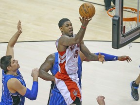 Raptors forward Amir Johnson scores an easy two points against the Orlando Magic on Wednesday night at the Air Canada Centre. (USA TODAY SPORTS)