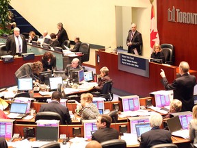 Mayor Rob Ford faces off with Deputy Mayor Norm Kelly at a special meeting of Toronto city council to deal with the 2014 budget on Wednesday, January 29, 2014. (Michael Peake/Toronto Sun)