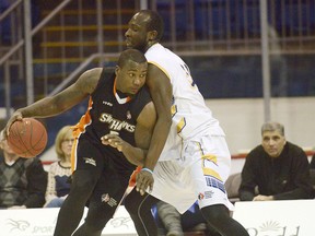 SkyHawks' Jermaine Johnson is guarded by a Storm player Wednesday night in Charlottetown. BRIAN McINNIS/The Guardian