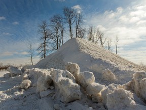 Everywhere there is an expanse of asphalt, piles of snow like this one behind the Amway building on Exeter Rd. can be expected. (MIKE HENSEN, The London Free Press)