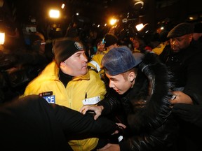 Pop singer Justin Bieber arrives at a police station in Toronto January 29, 2014. (REUTERS/Alex Urosevic)