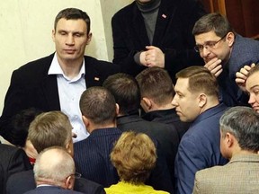 Ukrainian heavyweight boxer and opposition politician Vitaly Klitschko (top L) attends a Parliament session in Kiev, January 29, 2014.   REUTERS/Gleb Garanich
