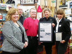Lisa Thompson, Huron Bruce MPP, along with a representative from the Ontario Trillium Foundation present a historic plaque to Sills Home Hardware, along with Huron East CAO Brad Knight and economic development officer Jan Hawley.