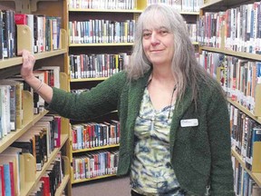 Byron head librarian Susan Price is at home among the books. The library has a collection of local history that Price hopes to show off in the coming months.