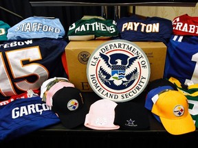 Samples of seized NFL counterfeit merchandise is put on display during a news conference in Indianapolis February 2, 2012. (REUTERS/Jim Young)