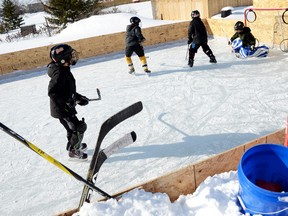 Belleville, ON, (01/30/2014) A handful of kids play hockey on an outdoor rink built by Belleville resident Darrell Steele Thursday, Jan. 30, 2014. Steele said its nice to see the kids – who enjoyed a PA Day Thursday – embracing winter instead of staying inside. 
Emily Mountney/The Intelligencer/QMI Agency