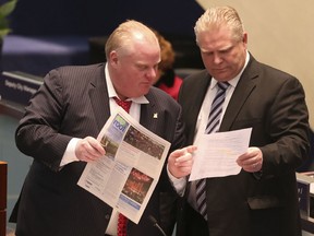 Mayor Rob Ford with his brother councillor Doug Ford as Toronto city council debates the budget on Thursday, January 30, 2014. (Veronica Henri/Toronto Sun)