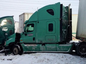 A pair of transport trucks caught up in Wednesday's massive crash on Hwy. 401 near Napanee.