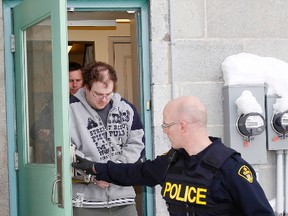 James Beau Jeffery, 29, is escorted out of Picton Courthouse by OPP officers after the fourth day of proceedings in his second-degree murder trial Thursday afternoon, Jan. 30, 2014 - JEROME LESSARD/The Intelligencer/QMI Agency