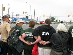 Protesters try to prevent the removal of the cattle herd from the prison farm at Frontenac Institution on Aug. 8, 2010. The property is currently being considered within a city report for an area of urban growth.