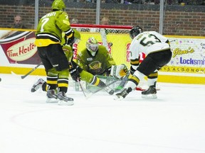 Knights forward fires the puck over Battalion goalie Jake Smith for London?s eighth goal of their OHL game  Thursday night in North Bay. The Knights won 9-4. (BRUCE COWAN, QMI Agency)