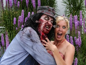 John Migliore, left, poses as Tom Zombie with Anita Twynstra, Tom Zombie Festival organizer and What's Up Elgin community television host, in a publicity shoot at Canadale Nurseries for the 2013 St. Thomas Tom Zombie Festival. Tim Harvey/Whitepine Photography