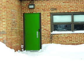 Snow hangs off the roof precariously over a secondary door at King George VI on Jan. 29.