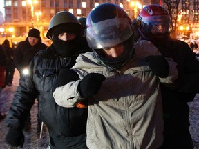 Anti-government protesters from far-right group "Right Sector" train in Independence Square in Kiev January 31, 2014. Ukraine's embattled President Viktor Yanukovich on Friday signed into law an amnesty for demonstrators detained during mass unrest and repealed anti-protest legislation, in a fresh bid to take the heat out of the political crisis. REUTERS/David Mdzinarishvili