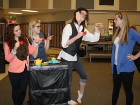 Greystone Centennial Middle School students Jordan Melnyk, the Mad Hatter and Miranda Torbert, the Dormouse, practise along side fellow “Alice” castmates during an Inferno Theatre rehearsal. - Photo Supplied