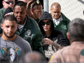 Justin Bieber (R) exits from the Turner Guilford Knight Correctional Center on January 23, 2014 in Miami, Florida.

Joe Raedle/LFP