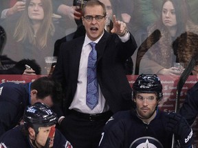 Paul Maurice, head coach of the Winnipeg Jets, gestures from the bench in third period action in an NHL game against the Vancouver Canucks at the MTS Centre on January 31, 2014 in Winnipeg, Manitoba, Canada. (Marianne Helm/Getty Images/AFP)