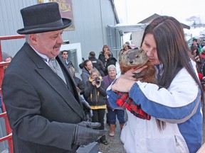 Oil Springs Ollie, the official weather forecaster for the Village of Oil Springs, is passed back to handler Peggy Jenkins of Heaven's Wildlife Rescue after the groundhog told Mayor Ian Veen, dressed in tuxedo and top hat on Sunday, that there would be six more weeks of winter like weather. The Groundhog Day celebration was held in the parking lot of the Oil Springs Youth Centre, where a community breakfast was held after the prediction.
DAVID PATTENAUDE / THE PETROLIA TOPIC