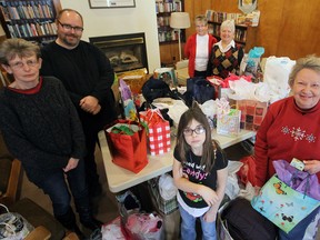 The annual St. John’s Anglican Church Outreach Committee Shower Saturday morning at the church included (front row, left to right): Ellie Ward and Mary Lou Sergeant; and in the back row, Marily Spice and Eric Schmiedl of Operation Sharing; and Elaine Balpataky and Sharron Hurst, pictured here with some of the shower gifts.