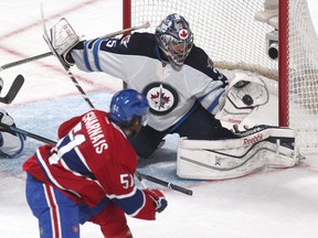 Winnipeg Jets goalie Al Montoya (35) makes a save against Montreal Canadiens centre David Desharnais (51) during the second period at Bell Centre. (Jean-Yves Ahern-USA TODAY Sports)