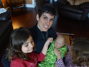 Dr. Kristi Adamo, a researcher with the Health Active Living research group at CHEO who says healthy weights for kids begin in the womb, plays with her own daughters Kysia, left, and Mallea.
MEGAN GILLIS/OTTAWA SUN/QMI AGENCY
