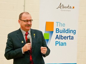 Provincial Infrastructure minister Ric McIver announces St. Michael's involvement in the program that will see the modernization of 70 Alberta schools. The announcement re-sparked an idea laying in embers for a performing arts theatre to be built in Pincher Creek. Bryan Passifiume photo/QMI Agency.