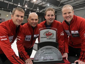 (L-R) Skip Jeff Stoughton, Jon Mead, Reid Carruthers and Mark Nichols pose with the trophy after defeating Mike McEwen 8-3 in the Safeway Select men's curling final in Winnipeg, Man. Sunday February 02, 2014. Carruthers has broken off and will form a new team that he will skip. (Brian Donogh/Winnipeg Sun/QMI Agency file)