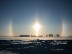 This delightful image of “sun dogs” was taken by Logan ward resident Katy Kolkman, looking east as the sun rose on a bitter cold morning last Tuesday, Jan. 28.