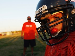 A youngster chews on his mouthguard during the filming of the television docu-series 'Friday Night Tykes' in this undated handout picture from the Esquire Network taken in San Antonio, Texas. (REUTERS/Walter Iooss/Esquire Network/Handout)