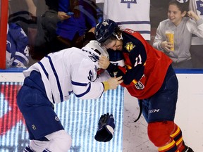 Maple Leafs defenceman Jake Gardiner (left) fights with Florida Panthers centre Jonathan Huberdeau during the second period on Tuesday night in Sunrise, Fla. (Robert Mayer/USA Today Sports)