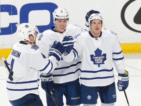 Maple Leafs winger David Clarkson (right) is congratulated by defencemen Cody Franson (left) and Jake Gardiner after he scored on Tuesday night against the Florida Panthers, in his first game back from injury. ( Joel Auerbach/Getty Images)