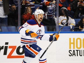 Feb 3, 2014; Buffalo, NY, USA; Edmonton Oilers center Matt Hendricks (23) celebrates after scoring a short-handed goal for the game-winner against the Buffalo Sabres during the third period at First Niagara Center. Oilers beat the Sabres 3-2. Mandatory Credit: Kevin Hoffman-USA TODAY Sports