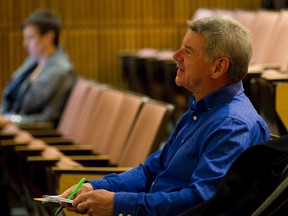 Former Ross Sheppard High School physics teacher Lynden Dorval is seen preparing to speak at a public meeting of the Edmonton Public School Board on Tuesday. (IAN KUCERAK/Edmonton Sun)