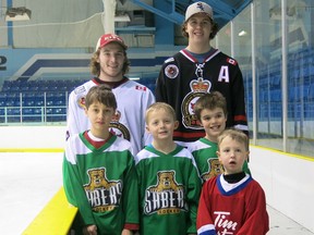 The Legionnaires Jr. 'B' club and minor hockey squads across Lambton County will take part in Saturday's annual Hockey Day in Sarnia celebrations. Shown here promoting the event are, back row, from left: Legionnaires Jay Clarke and Thomas Moxley. Middle row, same order: atom players Liam Campbell, Jaxon Belay and Cole Clothier. Front: Tim Bit player Laughlin Campbell. PHOTO SUBMITTED BY ANNE TIGWELL