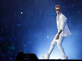 Justin Bieber surprised two fans in New York City on Saturday by gifting them with iPhones during a shopping trip at Apple's flagship store.

REUTERS/Mario Anzuoni