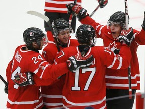 Rodney native Bo Horvat, far right, celebrates a goal against the United States during the third period of an IIHF World Junior Championship ice hockey game on Dec. 31, 2013. (REUTERS)