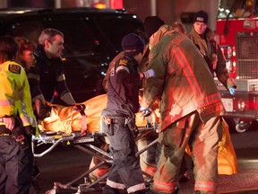 Emergency crews work on a man without vital signs after a shooting at 3435 Yonge St., north of Lawrence Ave. He was declared dead later in hospital. (VICTOR BIRO/Special to the Toronto Sun)