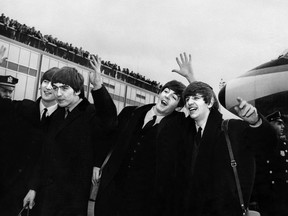In a file picture taken on February 7, 1964 British band The Beatles (L-R) John Lennon, Ringo Starr, Paul McCartney and George Harrison, arrive at John F Kennedy Airport in New York. AFP PHOTO