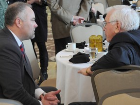 MPP Todd Smith speaks to local resident Bill Bird after his speech at a Belleville and District Chamber of Commerce breakfast. The Conservative member spoke extensively about electricity issues during his speech to local business leaders Wednesday.