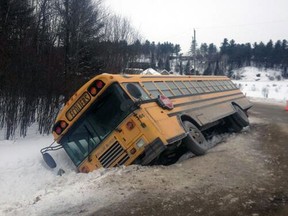 Police say five children suffered minor injuries Wednesday, Feb. 5, 2014 when this school bus toppled into ditch near Val-des-Monts. (MRC des Collines police image)