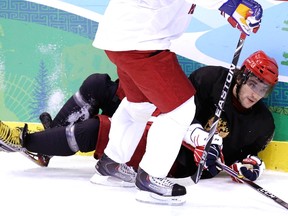 Russia's Alexander Ovechkin slides into the boards during a team practice at GM Place in Vancouver, B.C., on Monday, Feb. 15, 2010.  (Andre Forget/QMI Agency)