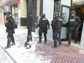 Police raided numerous locations in Winnipeg as part of an ongoing investigation, Wednesday, Feb. 5, 2014.  Chris Procaylo/Winnipeg Sun/QMI Agency
