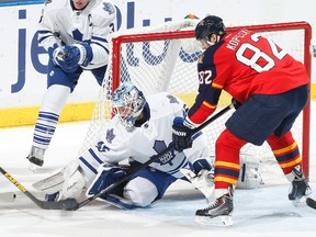 Maple Leafs goaltender Jonathan Bernier makes a save on the Panthers' Tomas Kopecky in Sunrise, Fla., on Tuesday night. Bernier made 44 saves in Toronto's loss. ( Joel Auerbach/Getty Images/AFP)