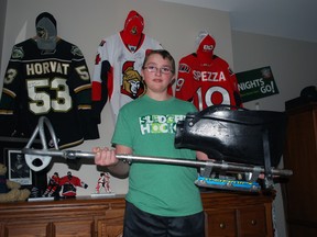 James Dunn holds a hockey sledge in his bedroom near Wallacetown. Dunn is a cancer survivor and amputee who recently took up sledge hockey, finding a new outlet for his love of Canada's favourite pastime. Ben Forrest/Times-Journal