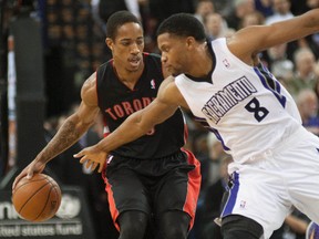 Sacramento Kings small forward Rudy Gay (8) attempts to steal the ball from Toronto Raptors shooting guard DeMar DeRozan (10) during the first quarter at Sleep Train Arena. (Ed Szczepanski-USA TODAY Sports)