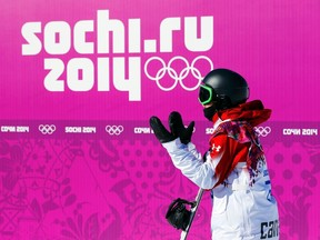 Canada's Mark McMorris reacts to his score at the finish line during the men's slopestyle snowboarding qualifying session at the 2014 Sochi Olympic Games in Rosa Khutor February 6, 2014. (REUTERS/Mike Blake)